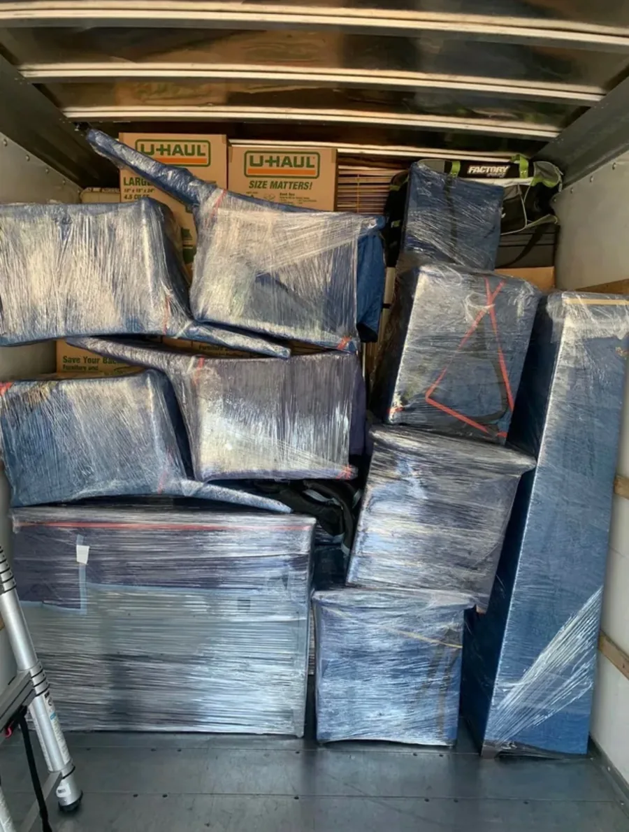 Furniture and boxes packed safely inside a moving truck